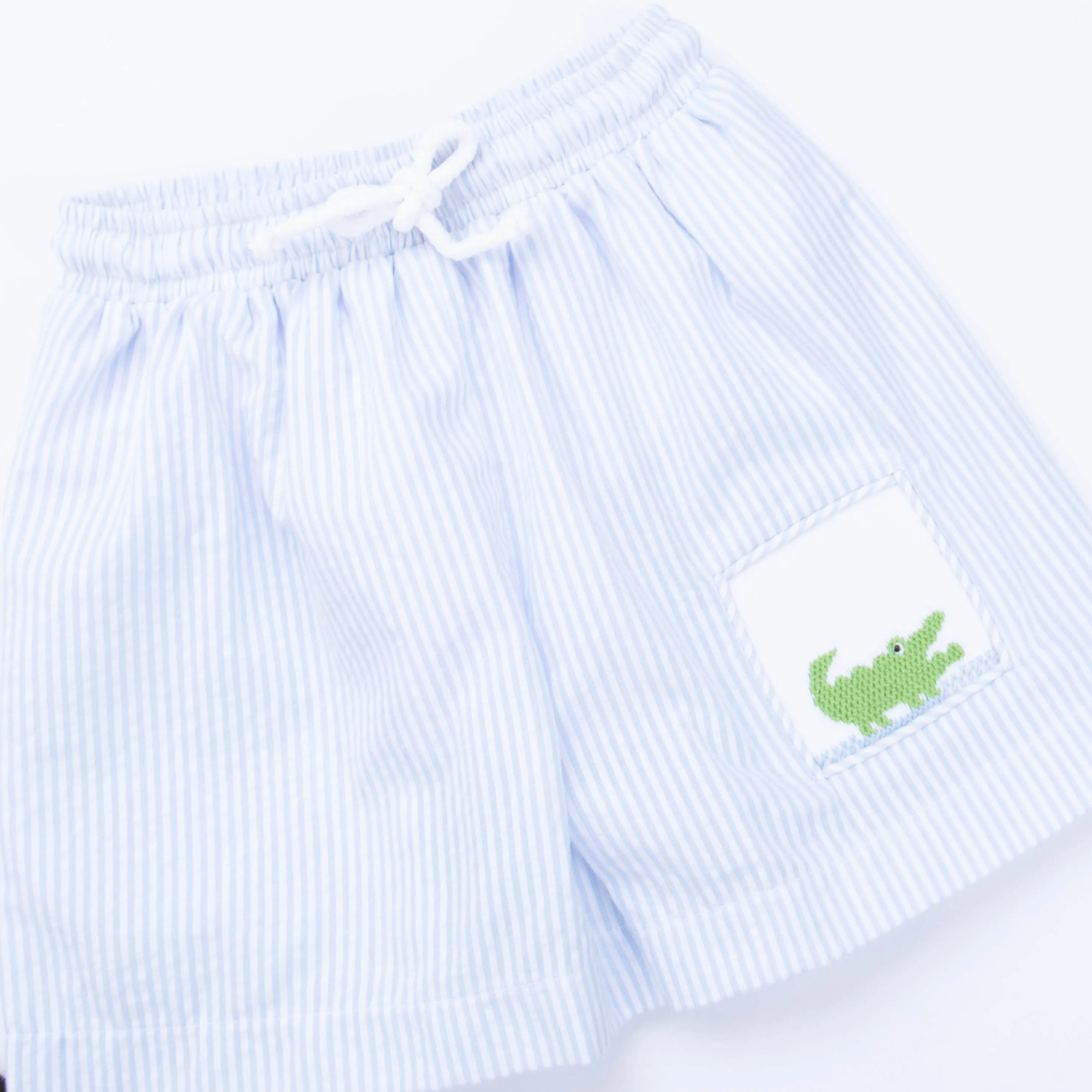 Chomp! Chomp! Smocked Swim Trunks, Blue