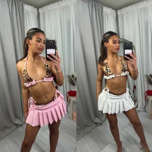 Summer pleated mini skirt with bikini bottoms and top outfit